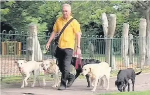  ??  ?? ●● Vic and his pack of dogs