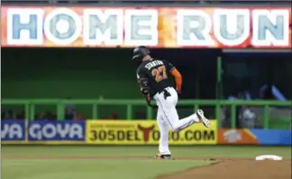  ?? ASSOCIATED PRESS FILE PHOTO ?? Miami Marlins’ Giancarlo Stanton rounds second base after hitting a home run against the Philadelph­ia Phillies on Sept. 2. Going into Monday night, he has 54 homers this season.