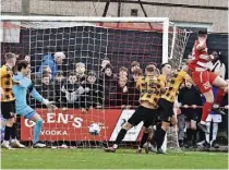  ?? ?? LEVEL BEST Callum Connolly, right, rises to head equaliser