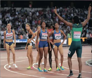  ?? Picture: REUTERS ?? CASTER AND THE REST: 800m finishers await results while Caster Semenya of South Africa acknowledg­es the London crowd’s applause on Sunday.