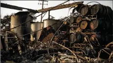  ?? MARCUS YAM/LOS ANGELES TIMES FILE PHOTOGRAPH ?? Wine making equipment sits in ruins after a wildfire destroyed Paradise Ridge Winery in Santa Rosa on Oct. 11.