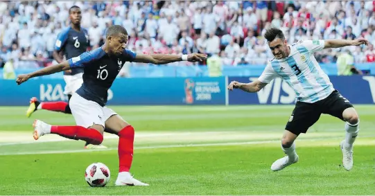  ?? RICARDO MAZALAN/THE ASSOCIATED PRESS ?? The play of French teenager Kylian Mbappe, left, at this year’s World Cup has many touting him as the next superstar in the sport.