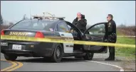  ??  ?? San Joaquin County Sheriff’s deputies on Brandywine Road, where it turns to East Harvest Road after they had shut down East Frontage Road from East Harvest Road to East Cooper Road as they search for a suspect Thursday in the Acampo area.