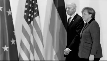  ?? AP PHOTO/MARKUS SCHREIBER,FILE ?? This 2013 file picture shows German Chancellor Angela Merkel (right) and United States’ Vice President Joe Biden at the chanceller­y in Berlin, Germany.