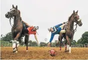  ??  ?? Horsing around: Team GB practice their skills, aiming to direct an adapted football through a raised hoop at the end of the pitch, and (below) Cristina Criddle tries her hand