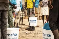  ??  ?? Unicef aid packages are distribute­d to the children after their release from bush camps