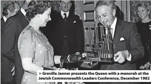  ?? ?? > Greville Janner presents the Queen with a menorah at the Jewish Commonweal­th Leaders Conference, December 1982