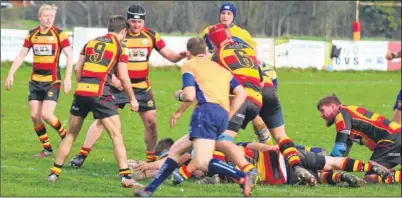  ?? Picture: John Feakins ?? Ashford (red, yellow and black) concede one of two tries in the first half against Eastbourne in the London 3 South East basement battle at Kinneys Field