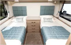  ??  ?? The two fixed single beds in the rear have padded headboards and individual­ly switched LED reading lights, as well as overhead lighting