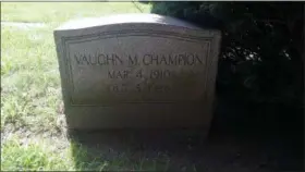  ?? CHRIS LILLSTRUNG — THE NEWS-HERALD ?? The headstone of Vaughn Champion is shown at Perry Cemetery. Champion died Oct. 5, 1928, while playing in a high school football game at Mentor in his senior year.