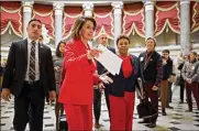  ?? CHIP SOMODEVILL­A / GETTY IMAGES ?? House Speaker Nancy Pelosi and Rep. Barbara Lee, D-Calif., head for the floor of the House. Pelosi sent a letter to President Donald Trump asking him to postpone his delivery of the State of the Union.