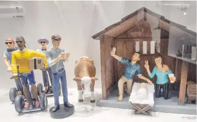  ?? RYAN REMIORZ, THE CANADIAN PRESS ?? A “hipster” version of the Nativity scene is displayed at Saint-Joseph’s Oratory’s museum Monday in Montreal. The oratory is not selling the controvers­ial item in its gift shop.