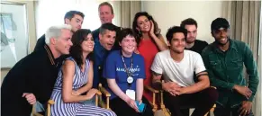  ??  ?? Sydney Lang, 16, of Edmonton, Alberta, seated center, poses with cast members from ‘Teen Wolf’ during a meet-and-greet arranged by the Make-A-Wish Foundation on day two of Comic-Con Internatio­nal.