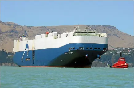  ?? PHOTO: STUFF ?? This car transporte­r will be among the first ships to be affected if workers strike at the Lyttelton port.