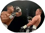  ??  ?? Joseph Parker, right, evades a punch from Anthony Joshua during their heavyweigh­t title fight in Cardiff.