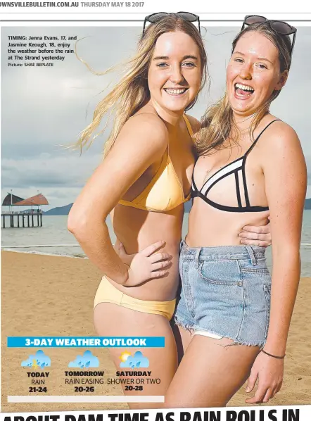  ?? TIMING: Jenna Evans, 17, and Jasmine Keough, 18, enjoy the weather before the rain at The Strand yesterday Picture: SHAE BEPLATE ??