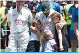  ?? — AFP ?? SYDNEY: Australia’s David Warner hugs his daughters after his 112th and farewell Test on day four of the third cricket Test match between Australia and Pakistan at the Sydney Cricket Ground in Sydney.