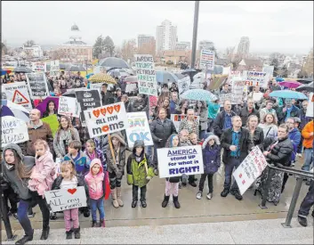  ?? The Associated Press file ?? Pro-polygamy protesters rally at the Utah Capitol in Salt Lake City in February 2017. Utah decriminal­ized polygamy in 2020, opening up the once-closed society.