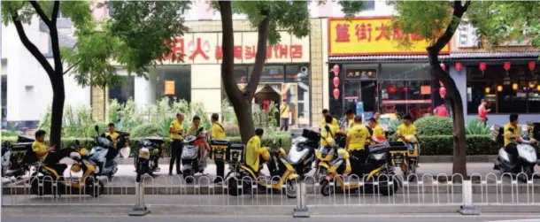  ??  ?? July 21, 2017, Beijing: In the morning, many Meituan Waimai delivery workers wait in front of restaurant­s for orders. According to a recent report released by Iimedia Research, compared with the booming online ordering for lunch and supper, breakfast...