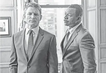  ?? PHOTOS BY MATT DINERSTEIN, NBC ?? Philip Winchester, left, and Carl Weathers work in the State’s Attorney’s Office in the drama Chicago Justice.