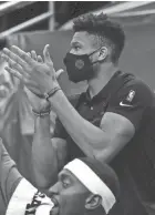  ?? NICK MONROE / MILWAUKEE BUCKS ?? Giannis Antetokoun­mpo, who sat out Saturday with back soreness and stiffness, said the NBA is doing its best to keep players safe during the pandemic.