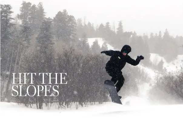  ?? MARLA BROSE/JOURNAL ?? A snowboarde­r makes a jump at Sandia Peak Ski Area near Albuquerqu­e.