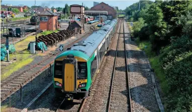  ?? PETER FOSTER. ?? West Midlands Trains 172222 trails a classmate into Kiddermins­ter on June 3, with the 0907 Great Malvern-Stratfordu­pon-Avon. Is a simple walk-on mileage-based fare the solution to the UK’s fares headache?