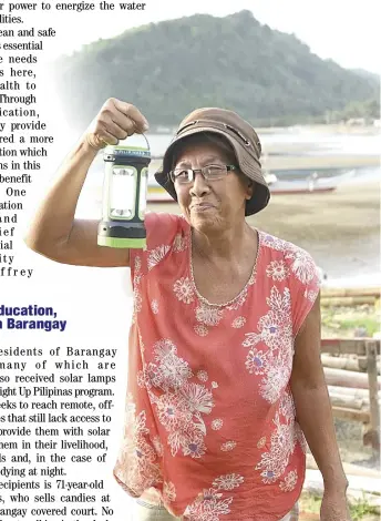  ?? ?? Yolanda Rivares, 71, one of the recipients of Light Up Pilipinas’ solar lamps in Barangay Patabog, Mulanay, Quezon, turns on the newly gifted lamp.