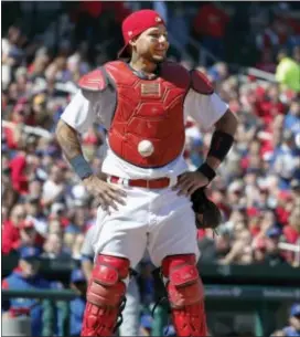  ?? JEFF ROBERSON — THE ASSOCIATED PRESS ?? St. Louis Cardinals catcher Yadier Molina stands with his hands on his hips as a ball is somehow stuck to his chest protector during the seventh inning against the Cubs on Thursday in St. Louis.