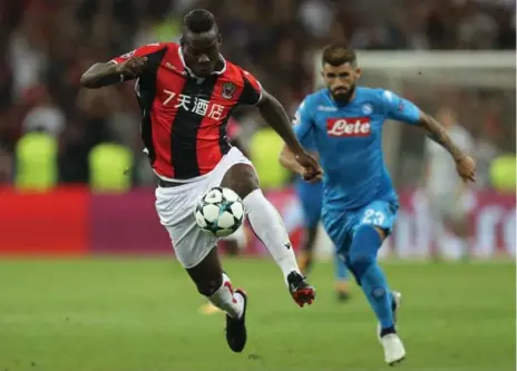  ?? VALERY HACHE/AFP/GETTY IMAGES ?? Mario Balotelli controls the ball during Champions League play on Tuesday. Balotelli was booed off the field after being substitute­d for late in the game.