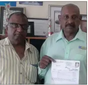  ??  ?? Councillor Ronnie Pillay, right, holds up Morgan Naicker’s, left, R7 million utility bill.