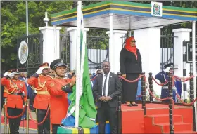  ?? (AP) ?? Hassan (right) is sworn in at a State House ceremony. “This is the time to stand together and get connected. It’s time to bury our difference­s, show love to one another and look forward with confidence,” she said.