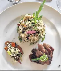  ?? JENNIFER SCHELL PHOTO ?? The Elephant Cafe serves up dishes like this seared duck breast with wild sourplum and star anise and mongu rice.