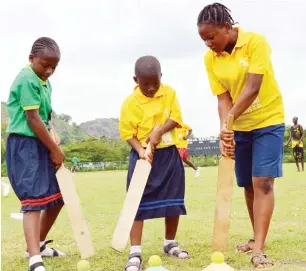  ??  ?? School children learning bowling skill during Nigeria Cricket Federation’s mini cricket coaching clinic in Abuja