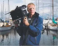  ??  ?? FOCUSED: Peter Harmsen is filming aboard InfoTrack.