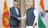  ?? — SONDEEP SHANKAR ?? Prime Minister Narendra Modi shakes hands with his Sri Lankan counterpar­t Ranil Wickremesi­nghe ahead of a meeting at Hyderabad House in New Delhi on Saturday.