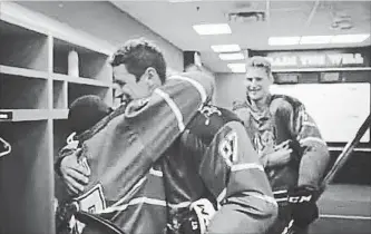  ?? HOLMYARD, BRAYDON TIM HORTONS ?? A smiling Sidney Crosby is hugged by a player from Kenya as Nathan MacKinnon watches in a new advertisem­ent for Tim Hortons in which the hockey stars join the Ice Lions to play against a local rec team.