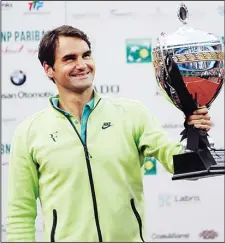  ??  ?? Switzerlan­d’s Roger Federer lifts the trophy after defeating Pablo Cuevas of Uruguay in the men’s final of the ATP Istanbul Open in Istanbul on May 3. (AFP)