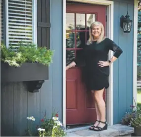  ?? Gabriel Scarlett, The Denver Post ?? Shannon Sisler could be opening a door to a home, but it’s really the Tuff Shed that she designed and decorated.