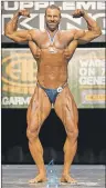  ?? SUBMITTED PHOTO/CHRIS WHITE ?? Chris White of Bras d’Or is shown on stage after winning the men’s heavyweigh­t competitio­n at the Nova Scotia Amateur Bodybuildi­ng Associatio­n’s provincial championsh­ip held in Halifax on April 8.