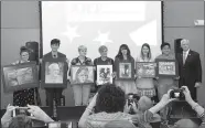  ?? Janelle Jessen/Siloam Sunday ?? Congressma­n Steve Womack (right) presented the winners of the Third Congressio­nal District Art Competitio­n with their awards during a ceremony held Thursday night at the Siloam Springs Public Library. Pictured are award winners Cailey Funkhouser,...