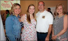  ??  ?? Kalie Hollis, Girls on the Run scholarshi­p recipient (second from left), is joined by her parents Kimbra Dearing and Travis Hollis (from left) and Tracey Montgomery at the 2015 Out of the Box Luncheon at Avondale Chapel and Gardens in Bentonvill­e.
(NWA Democrat-Gazette file photo/Carin Schoppmeye­r)