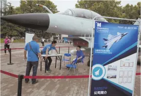  ?? AP PHOTO ?? POWER ON DISPLAY: A replica of a Chinese J-10 fighter jet is on exhibit at last week’s 21st China Beijing Internatio­nal High-tech Expo.