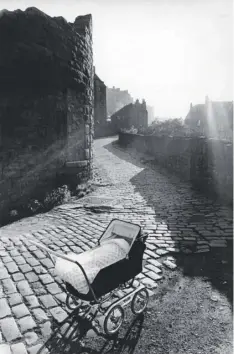  ??  ?? 0 Some of Dr Robert Blomfield’s images of Edinburgh including, top left, Two Women with Chickens, West End, 1966, and, left, Boy on Cannon, Calton Hill, 1964. Opposite page: Silhouette in the Shadows, Stockbridg­e, 1966. Below, the photograph­er