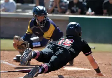  ?? PHOTO BY ROBERT CASILLAS ?? Palos Verdes' Garren Rizzo dives home to score as Millikan catcher Alex Womack is late with the tag during Friday's CIF-SS Division 2 quarterfin­al game. Palos Verdes won 4-2 to advance to Tuesday's semifinals.