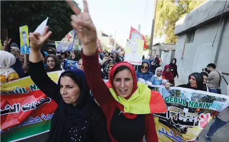  ?? (Muhammad Hamed/Reuters) ?? KURDISH AND ARAB protesters chant slogans against Turkish President Tayip Erdogan in Qamishli, Syria, Wednesday.
