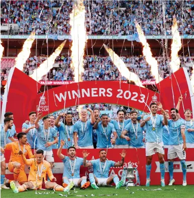  ?? ?? Manchester City players celebrate winnning the FA Cup final. Next up is an even bigger game against Inter Milan this Saturday.