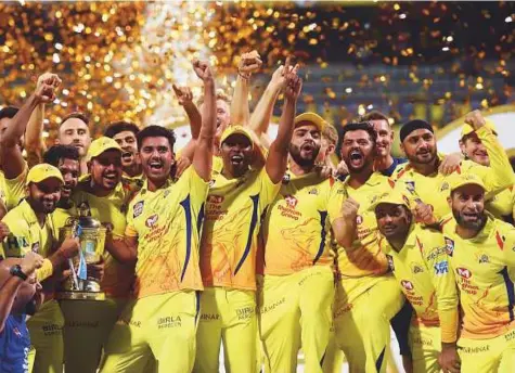  ?? PTI ?? Chennai Super Kings players celebrate with the trophy after winning the title clash against Sunrisers Hyderabad in the 11th edition of the Indian Premier League earlier this year.