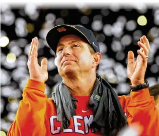  ?? KEVIN C. COX / GETTY IMAGES ?? MAN AT THE TOP: Clemson coach Dabo Swinney celebrates his Tigers’ last-minute victory over Alabama in the College Football Playoff championsh­ip game in January.