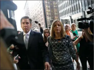  ?? The Associated Press ?? DENIED: Patti Blagojevic­h, right, wife of former Illinois Gov. Rod Blagojevic­h arrives at the federal courthouse Tuesday in Chicago before U.S. District Judge James Zagel resentence­d Blagojevic­h to his original 14-year term. An appeals court threw out...